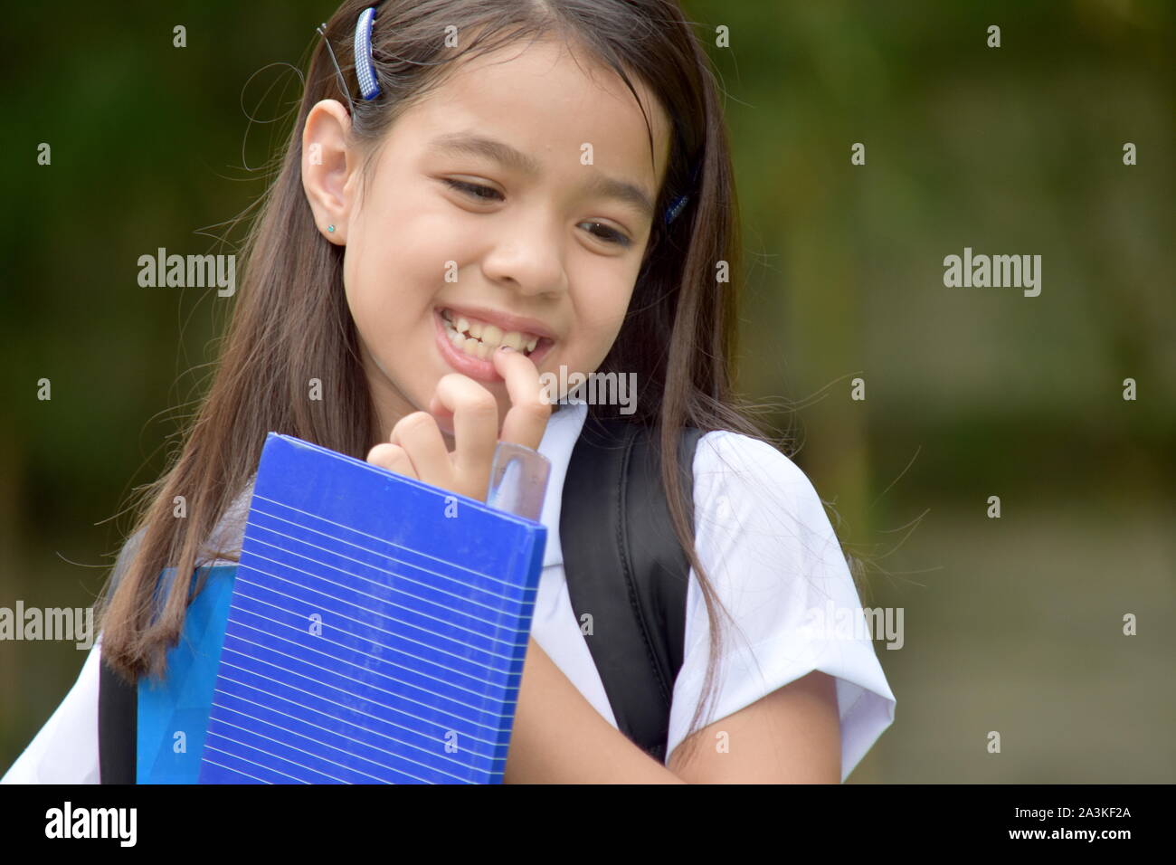 Shy Young Minority Child Girl Student Wearing School Uniform Stock Photo