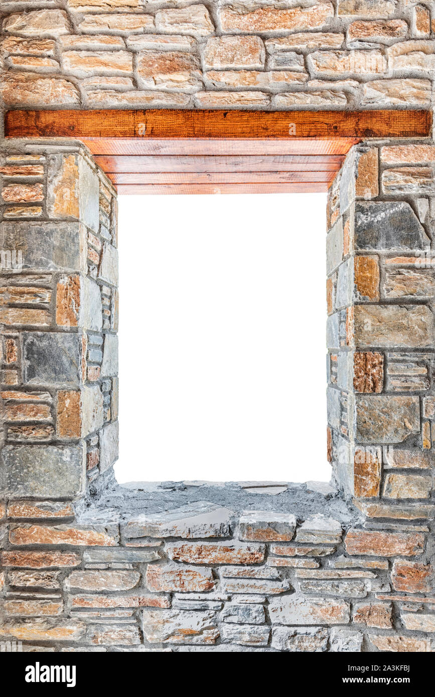 Window opening in a stone wall with wooden lintel Stock Photo