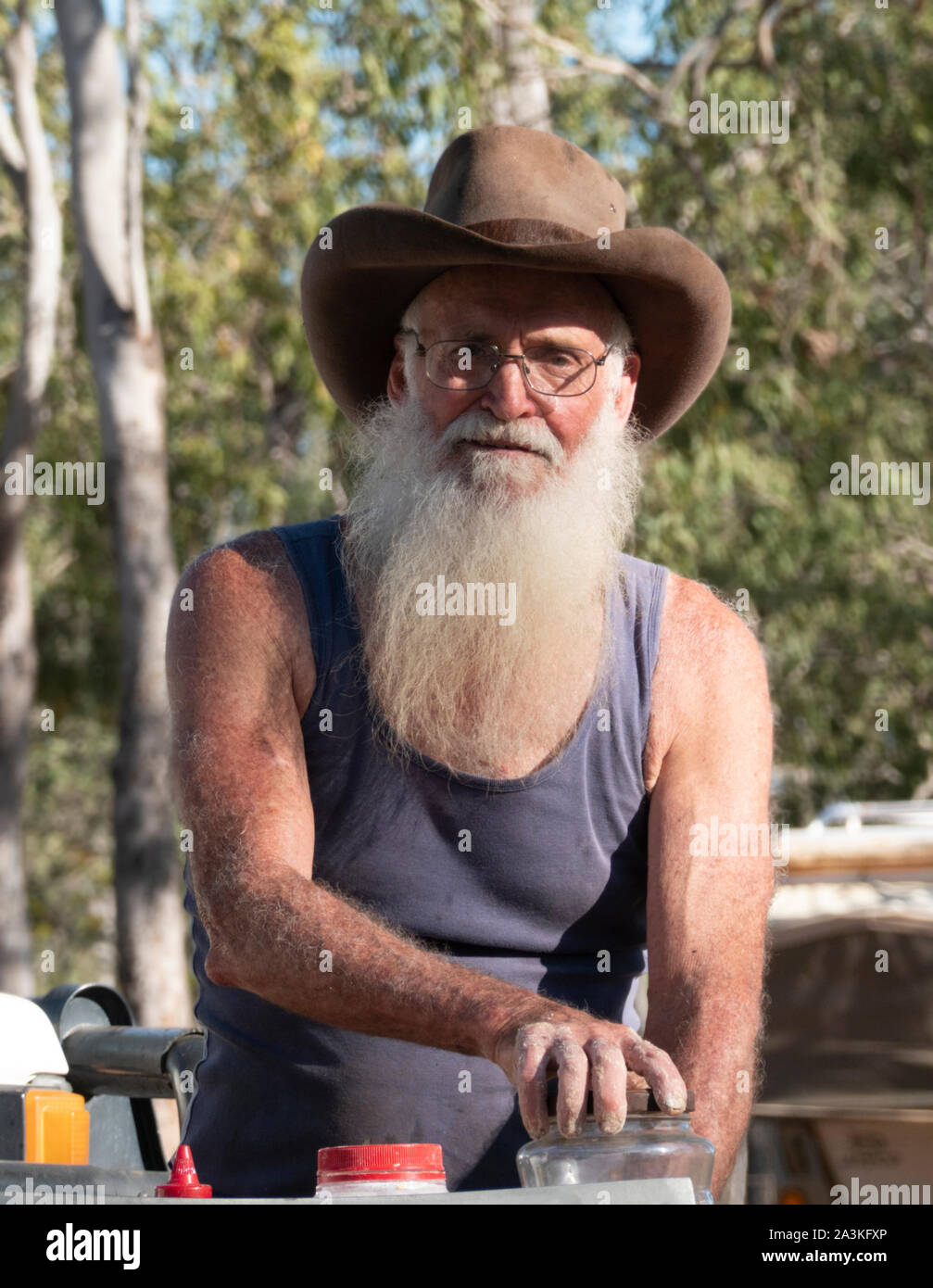 Portrait of an Australian Bushman with a long white beard and a cowboy hat, Mareeba, Queensland, QLD, Australia Stock Photo
