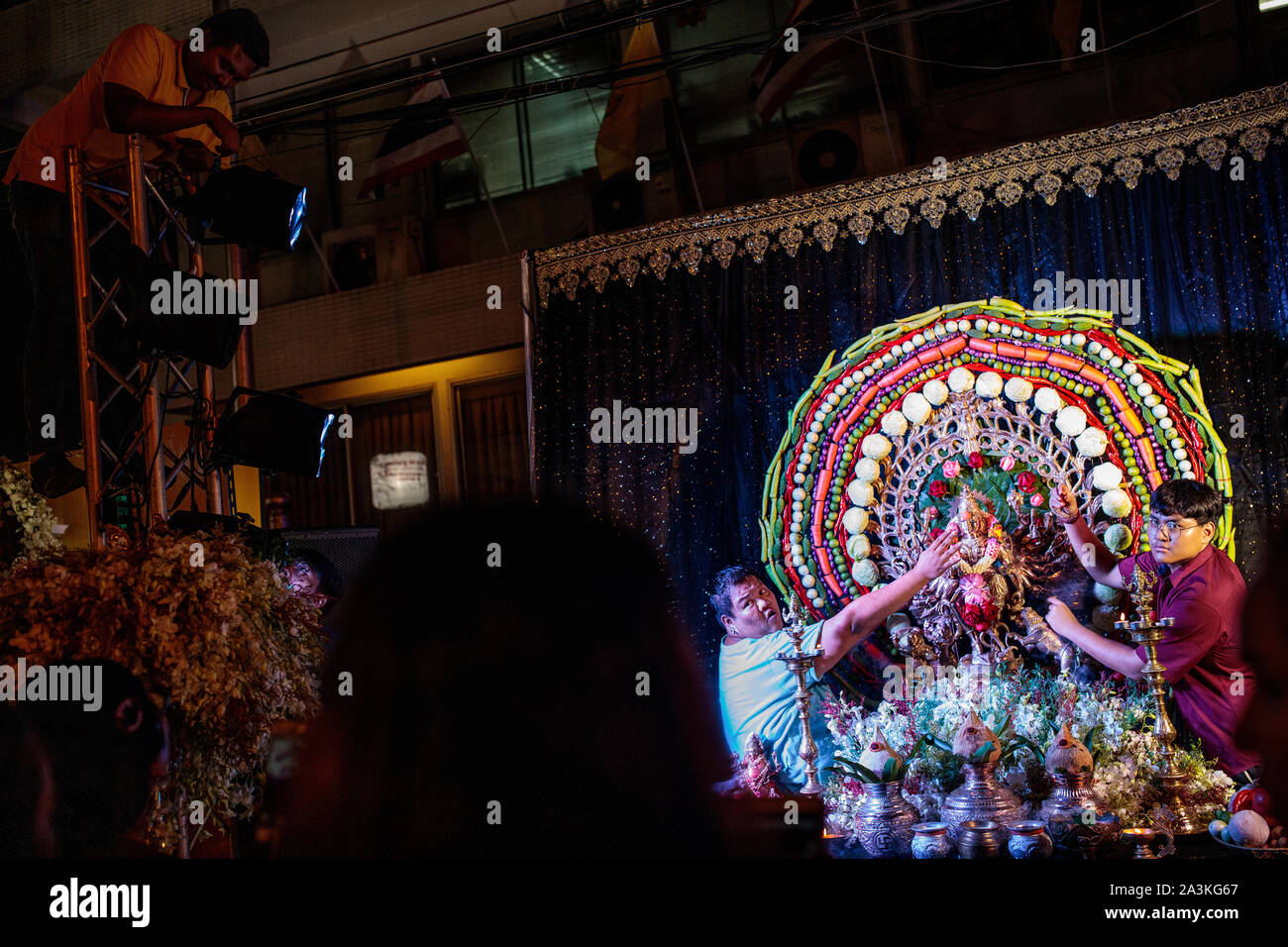 Hindu devotees take part in Navratri celebrations by the Sri Mariamman Temple on October 8, 2019 in Bangkok, Thailand. The widely observed Hindu festival of Navratri celebrates the victory of one of a number of gods, depending on the region, over evil and takes place over nine holy nights. Stock Photo