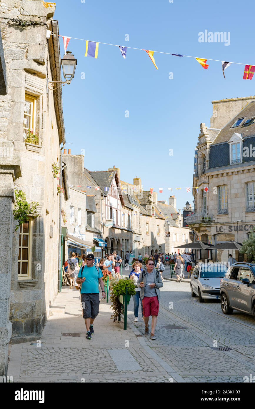 Roscoff, Finistere / France - 21 August 2019: tourists enjoy a visit and a walk around the historic Breton town of Roscoff Stock Photo