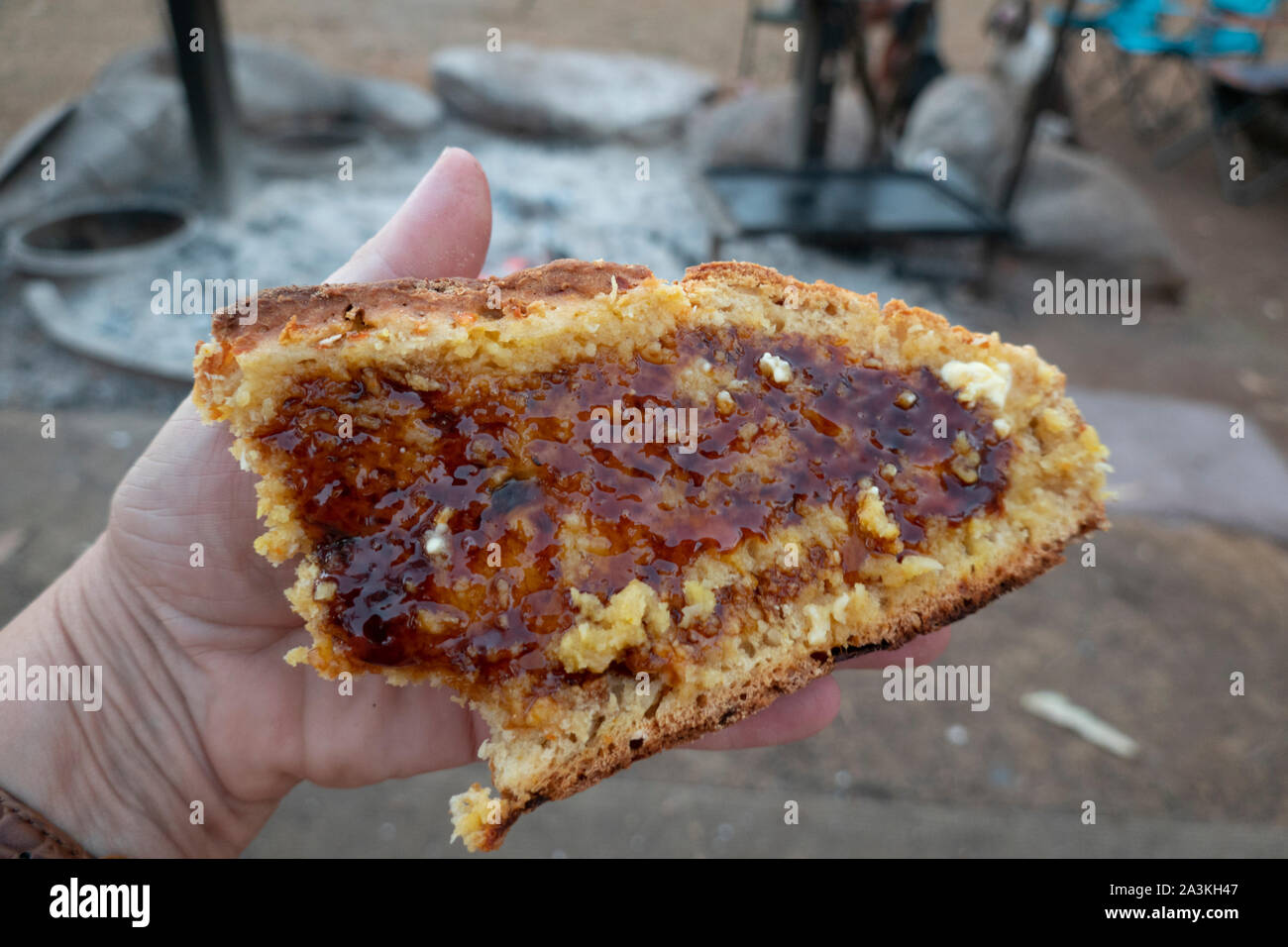 Freshly baked damper or Australian bread, with treacle and butter