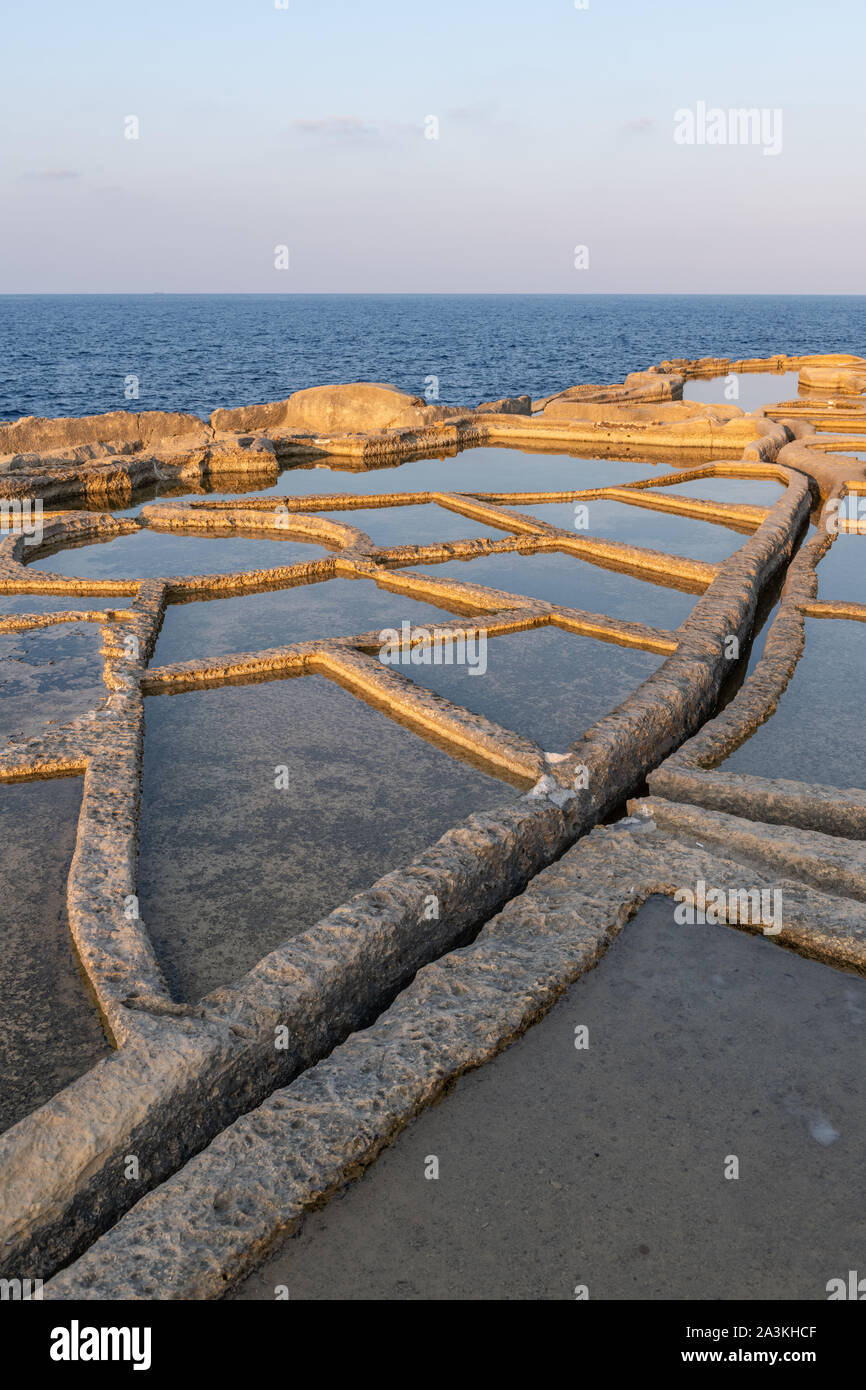 Salt Pans at golden hour, Gozo, Malta Stock Photo Alamy