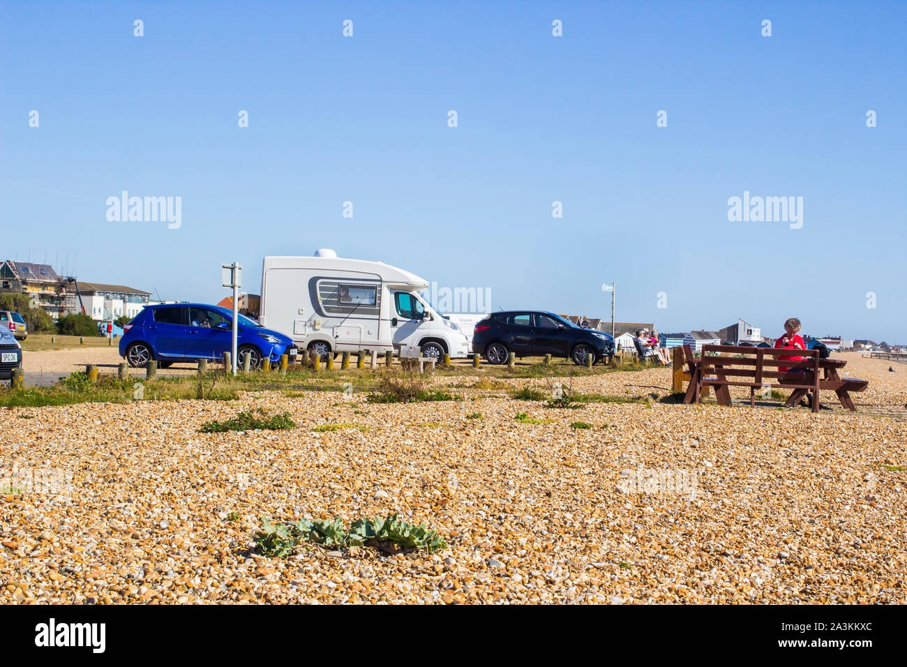 19 September 2019 Elderly folk taking the sun while visiting the beach at Hayling Island on the south coast of Enland Stock Photo