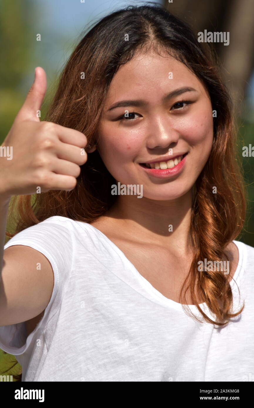 Young Female With Thumbs Up Stock Photo