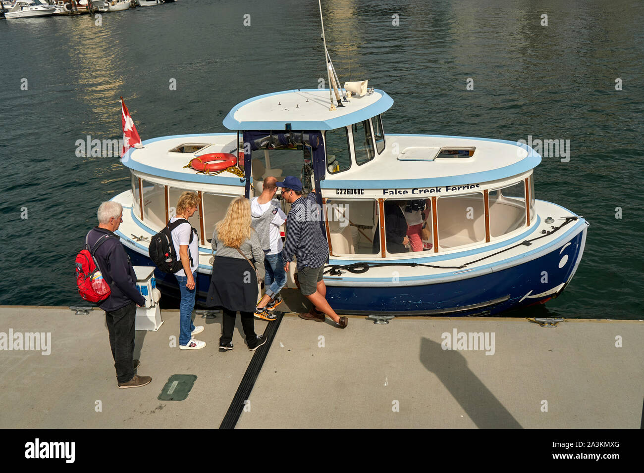 A view of a ferry boat loading passengers, Granville Island, Vancouver Stock Photo