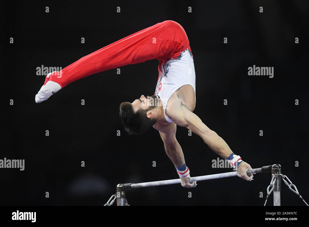 Stuttgart, Germany. 7th Oct, 2019. OLIVER HEGI from Switzerland competes on the high bar during the qualification round of competition held in the Hanns-Martin-Schleyer-Halle in Stuttgart, Germany. Credit: Amy Sanderson/ZUMA Wire/Alamy Live News Stock Photo