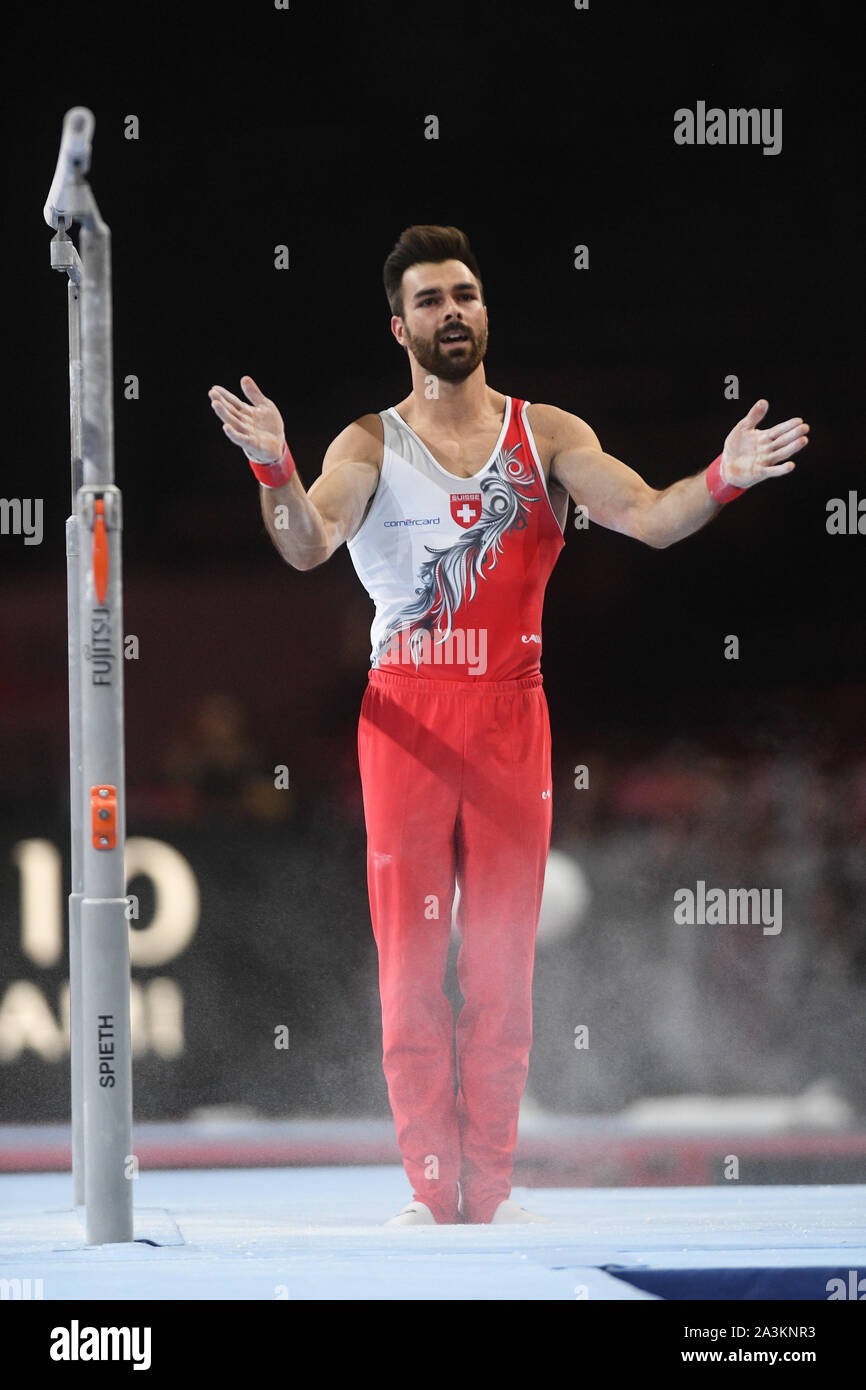 Stuttgart, Germany. 7th Oct, 2019. OLIVER HEGI from Switzerland celebrates after his dismount from the parallel bars during the qualification round of competition held in the Hanns-Martin-Schleyer-Halle in Stuttgart, Germany. Credit: Amy Sanderson/ZUMA Wire/Alamy Live News Stock Photo