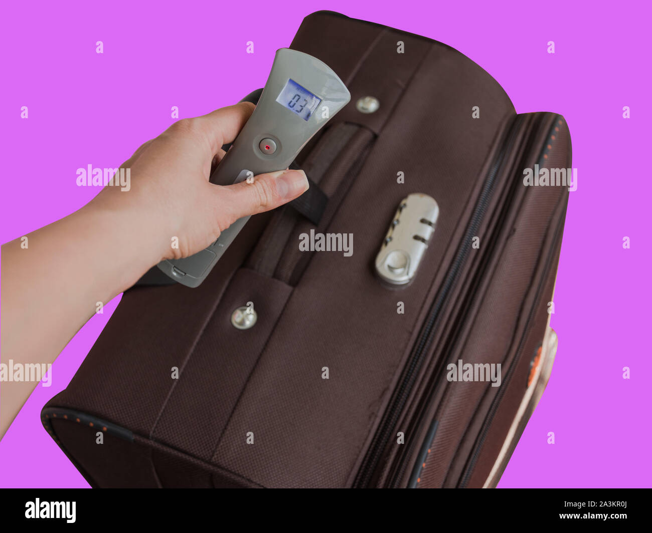 https://c8.alamy.com/comp/2A3KR0J/hand-of-woman-holding-digital-luggage-scales-avoid-baggage-overweight-in-airport-concept-pocket-baggage-digital-scales-travelling-accessories-2A3KR0J.jpg