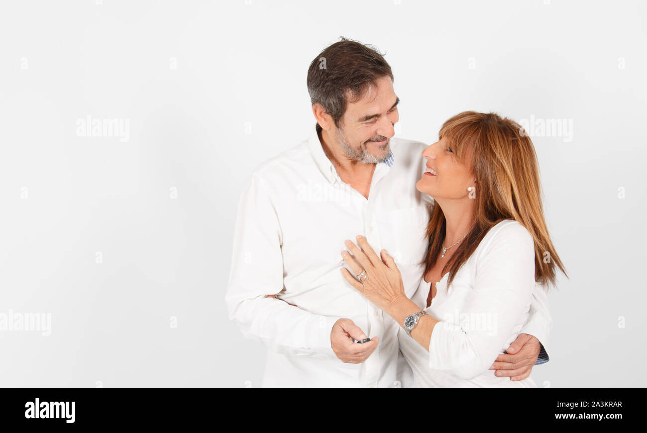 Fashion couple posing on grey studio background - Stock Image - Everypixel