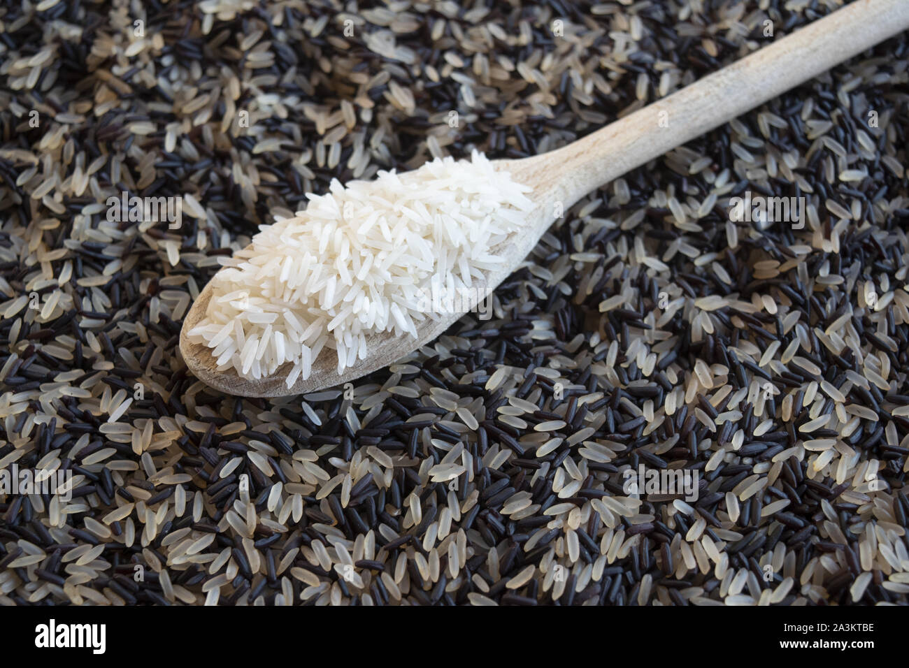 basmati rice on a bad of black rice Stock Photo Alamy