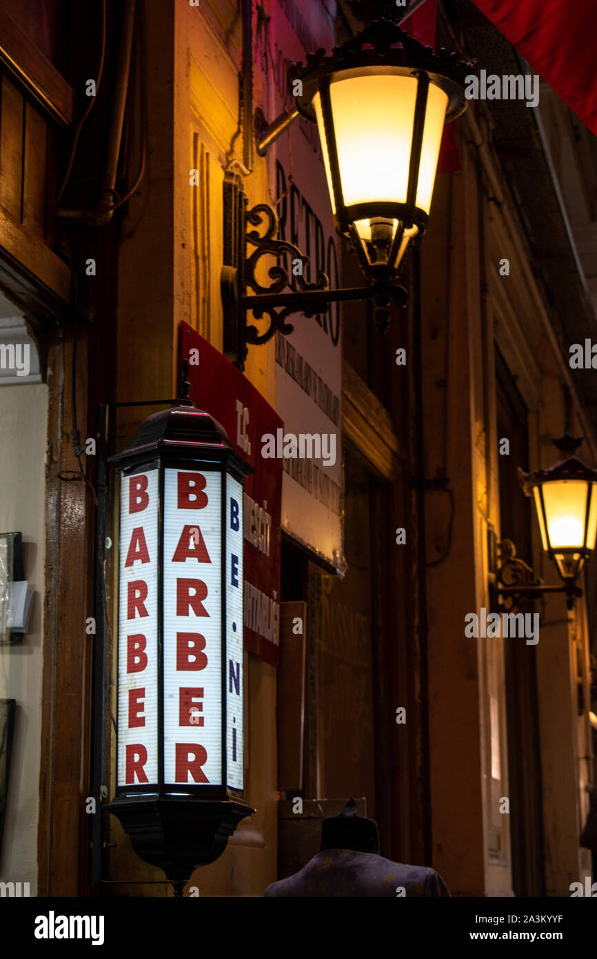 Istanbul: sign of a barber shop inside the Cicek Pasaji, the Flower Passage, an historic galleria on Istiklal Caddesi, famous avenue of the city Stock Photo