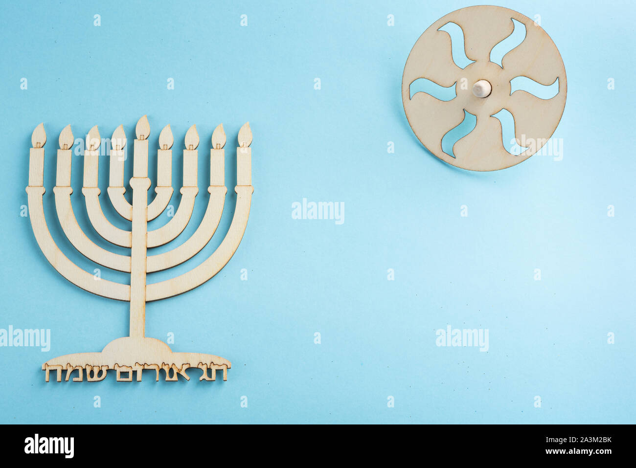 Children's craft Wood menorah candelabrum and wooden dreidels spinning