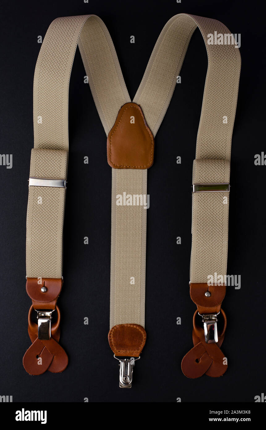 Suspenders, Men's accessories on black background. Top view,vertical Stock Photo