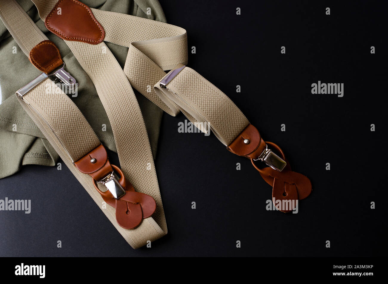 Male braces with leather details on black background with copoy space. Fashion and style concept Stock Photo