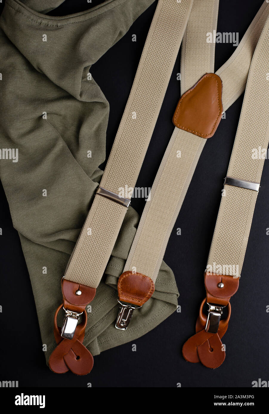 Top view of male accessories, suspenders or braces. Vertical image. Stock Photo