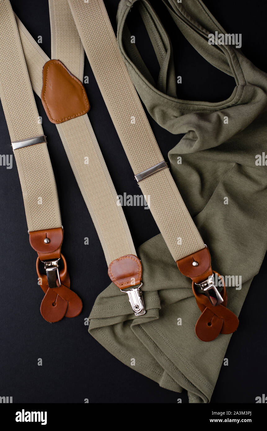 Top view of male accessories, suspenders or braces. Vertical image. Stock Photo