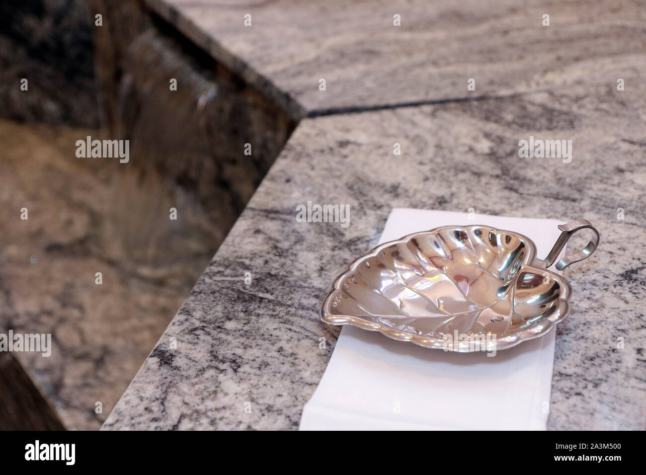 baptismal shell in catholic church - baptism shell church Stock Photo -  Alamy