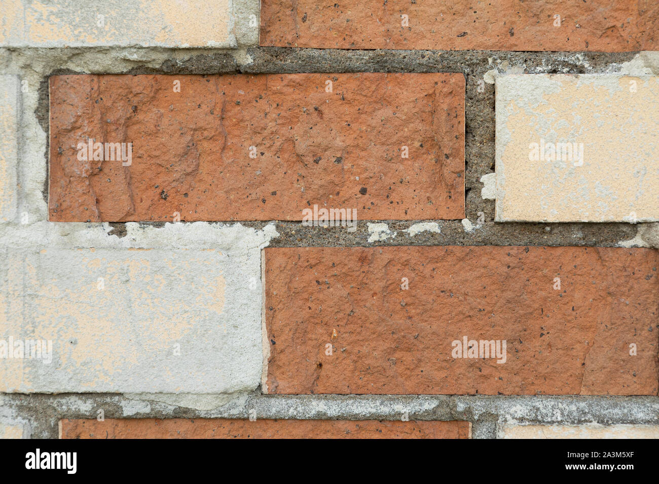 White and red brick wall with concrete in the gaps Stock Photo Alamy