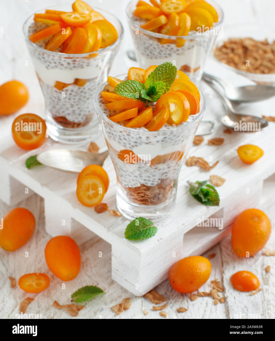 Chia pudding parfait, layered with kumquat and granola Stock Photo - Alamy