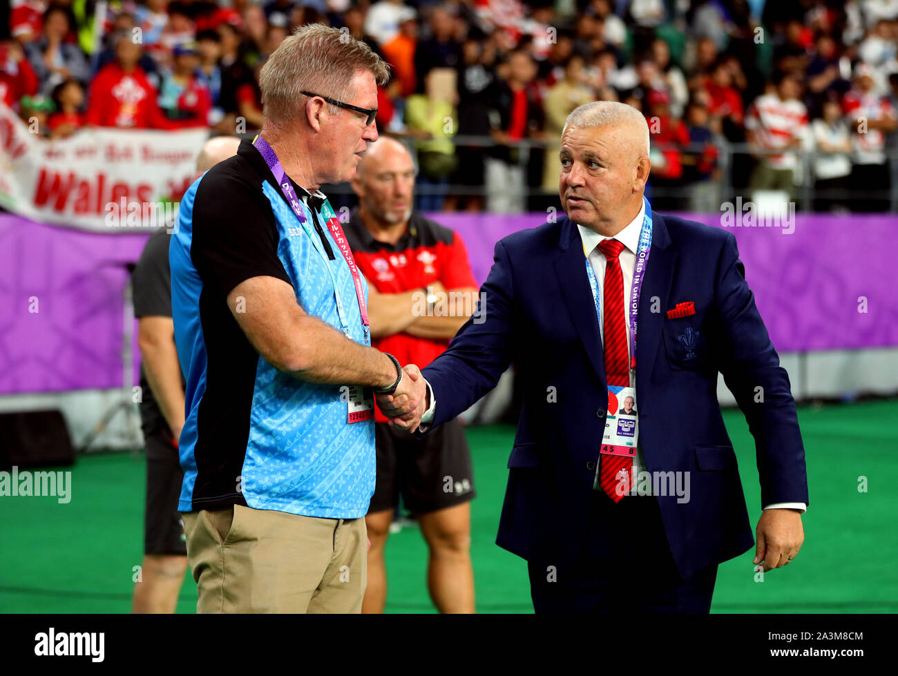 Wales Head Coach Warren Gatland (right) shakes hands with Fiji Head Coach John McKee at the end of the 2019 Rugby World Cup Pool D match at Oita Stadium. Stock Photo