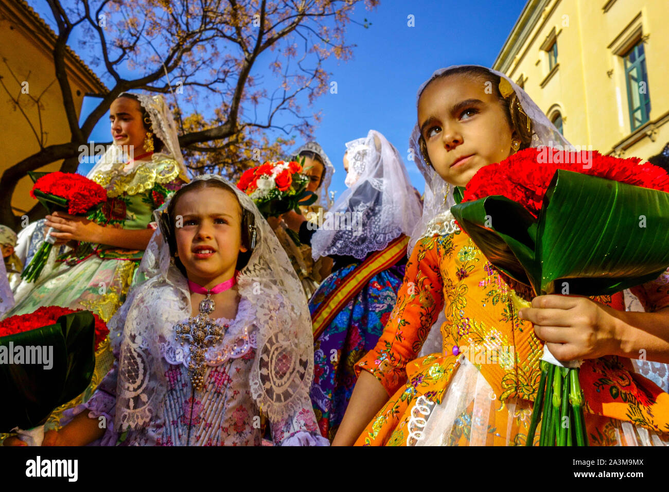 Kids Las Fallas Valencia festival Spain Girls Child Children Women Parade in traditional dress Spanish Las Fallas festival girls Stock Photo