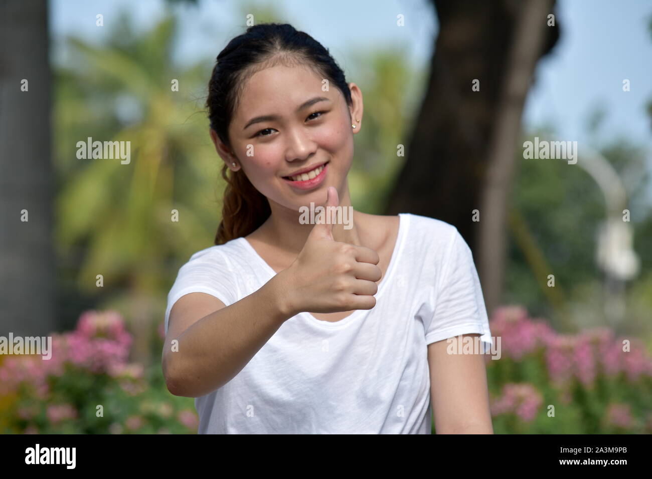 Beautiful Filipina Female With Thumbs Up Stock Photo
