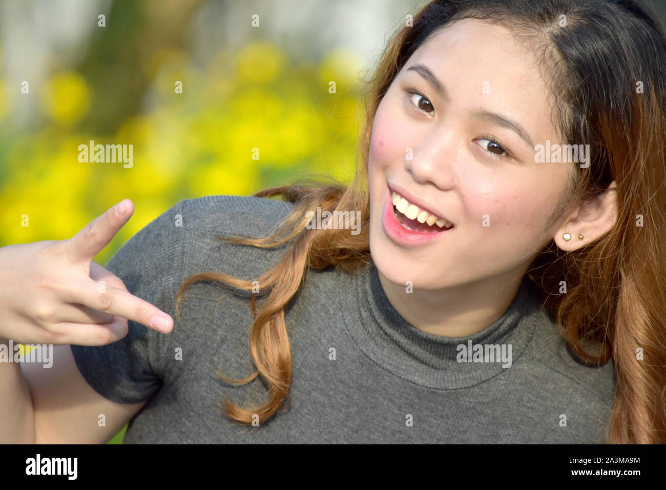 Young Filipina Adult Female Having Fun Stock Photo