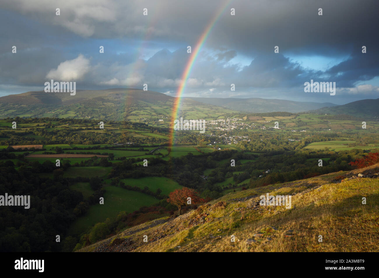 Rainbows over Crickhowell with the Black Mountains in the distance. Brecon Beacons National Park. Powys. Wales. UK. October 2019 Stock Photo