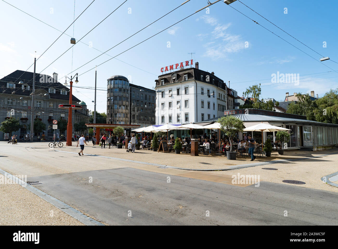 Biel, BE / Switzerland - 28 August 2019: busy downtown intersection with many pedestrians and shops and public transport bus station Stock Photo