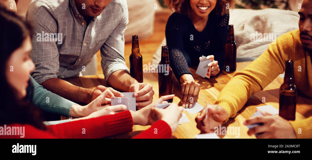 Millennial adult friends socialising together at home Stock Photo
