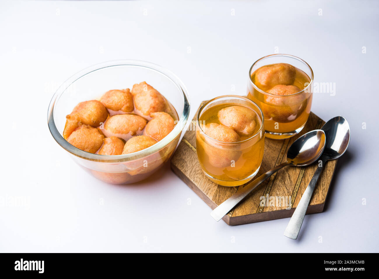 Kanji Vada / wada is a popular Rajasthani detoxifying dish consumed after over eating of sweets in Indian festival season. served in transparent Bowl Stock Photo