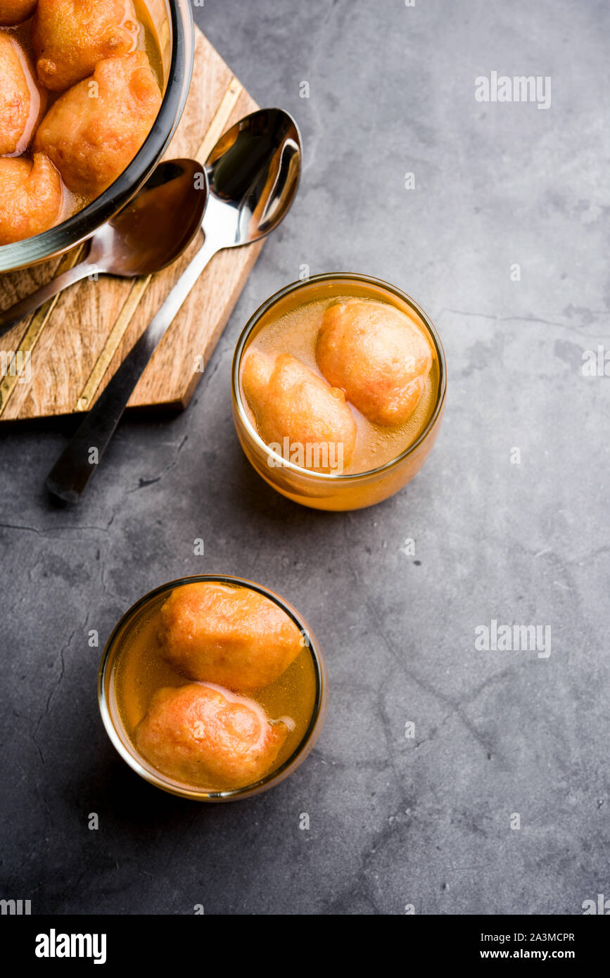 Kanji Vada / wada is a popular Rajasthani detoxifying dish consumed after over eating of sweets in Indian festival season. served in transparent Bowl Stock Photo