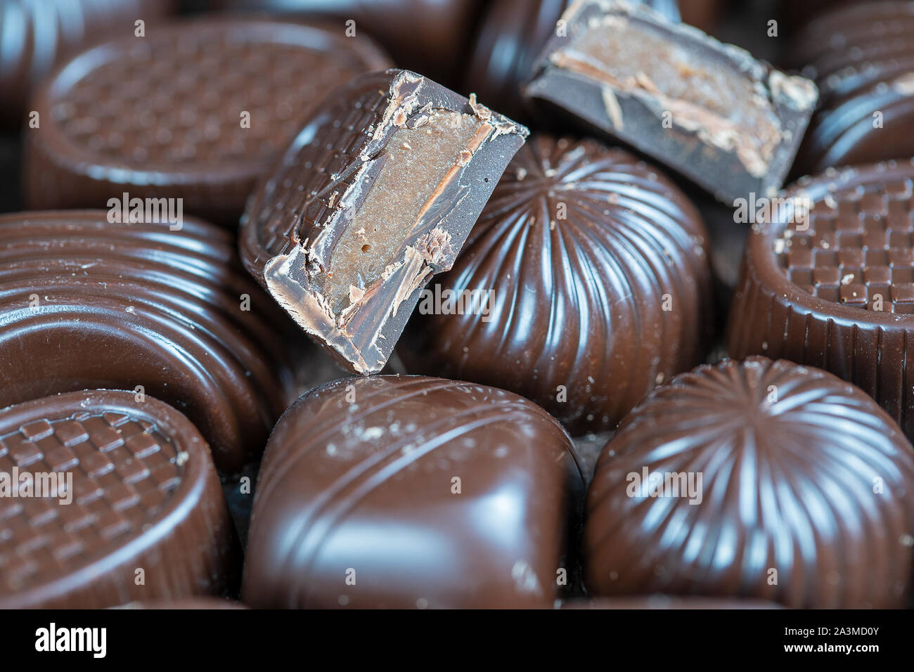 Close up brown chocolate candy background. Assortment of chocolate ...
