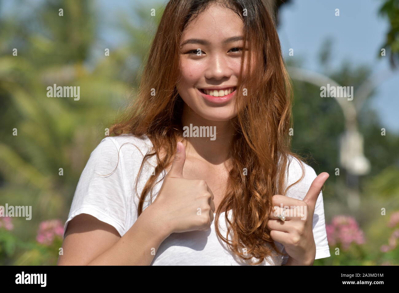 Young Female With Thumbs Up Stock Photo