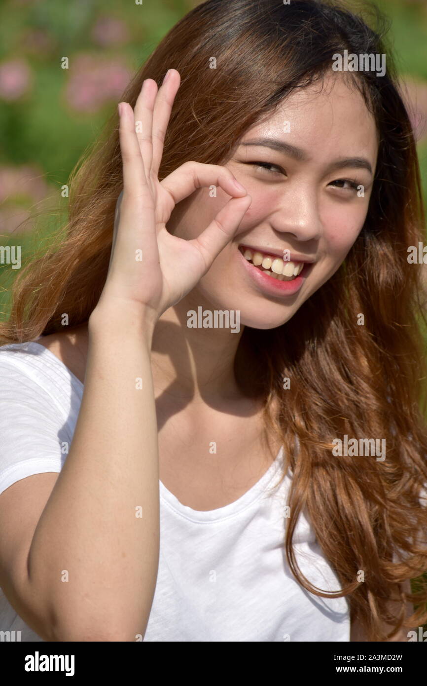 Young Female And Okay Sign Stock Photo