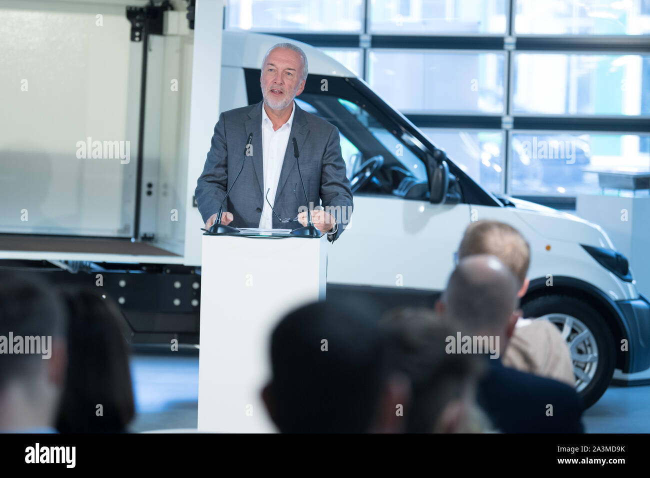 Berlin, Germany. 09th Oct, 2019. Reinhard Müller, CEO of Euref AG, speaks at the presentation of the new StreetScooter generation. With over 11,000 vehicles used by Deutsche Post alone, the StreetScooter is now Germany's leading energy and logistics platform for the last mile. In the near future, the company also wants to manufacture in China. Credit: Jörg Carstensen/dpa/Alamy Live News Stock Photo