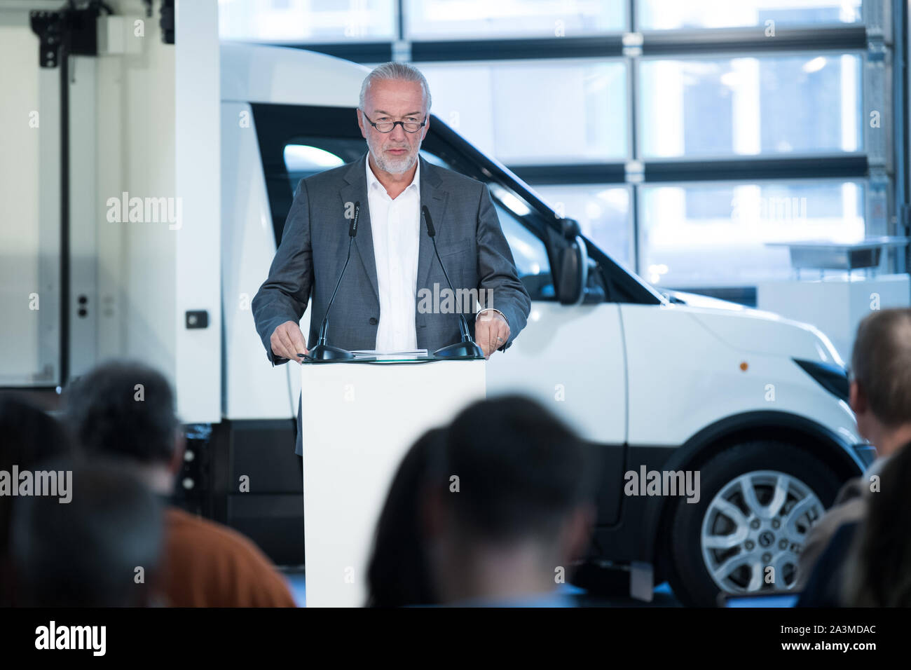 Berlin, Germany. 09th Oct, 2019. Reinhard Müller, CEO of Euref AG, speaks at the presentation of the new StreetScooter generation. With over 11,000 vehicles used by Deutsche Post alone, the StreetScooter is now Germany's leading energy and logistics platform for the last mile. In the near future, the company also wants to manufacture in China. Credit: Jörg Carstensen/dpa/Alamy Live News Stock Photo