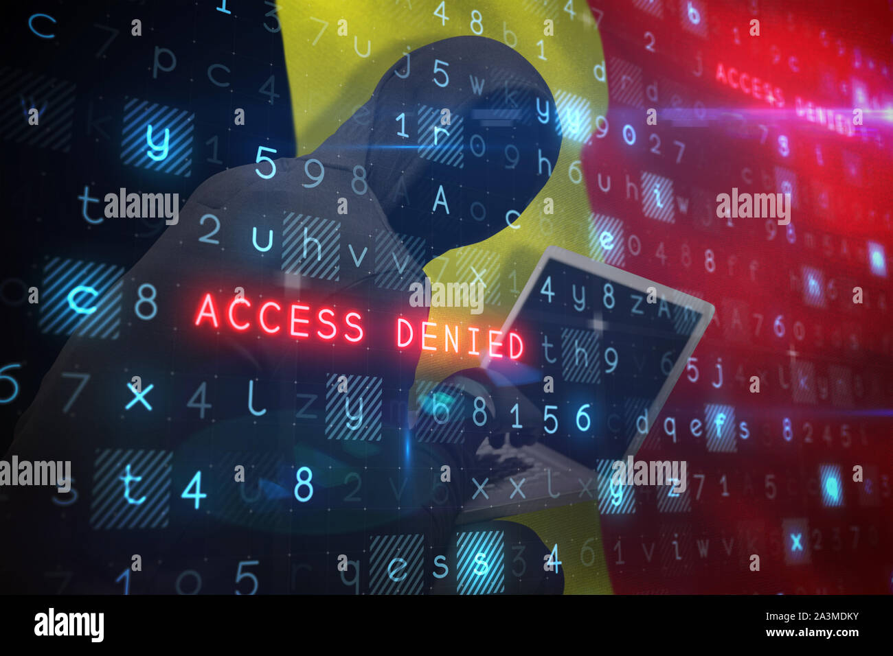 Composite image of hacker using laptop Stock Photo