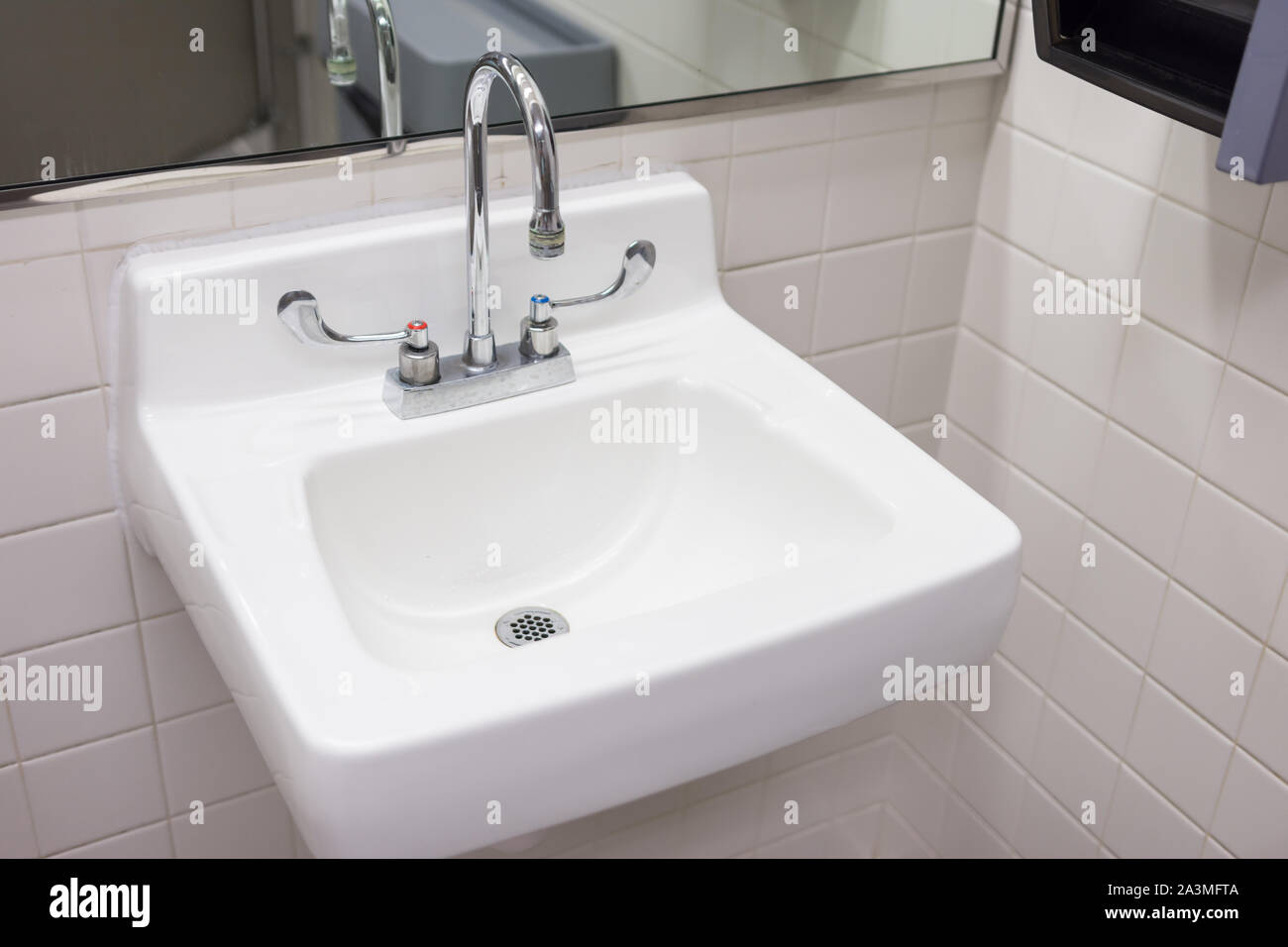 Clean white sink in typical american public restroom Stock Photo Alamy