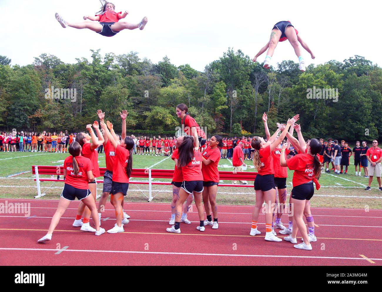 Cheerleaders at a high school football game Stock Photo