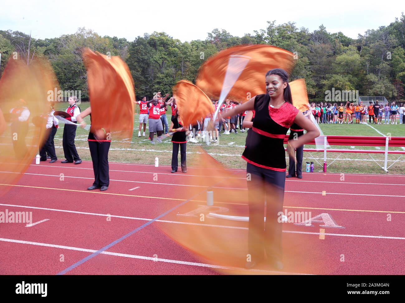 Cheerleaders at a high school football game Stock Photo