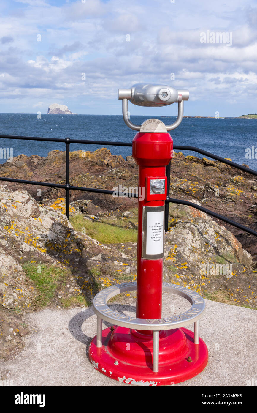 A coin operated telescope at North Berwick on the East Lothian Coast looking out towards The Bass Rock in the Firth of Forth Stock Photo