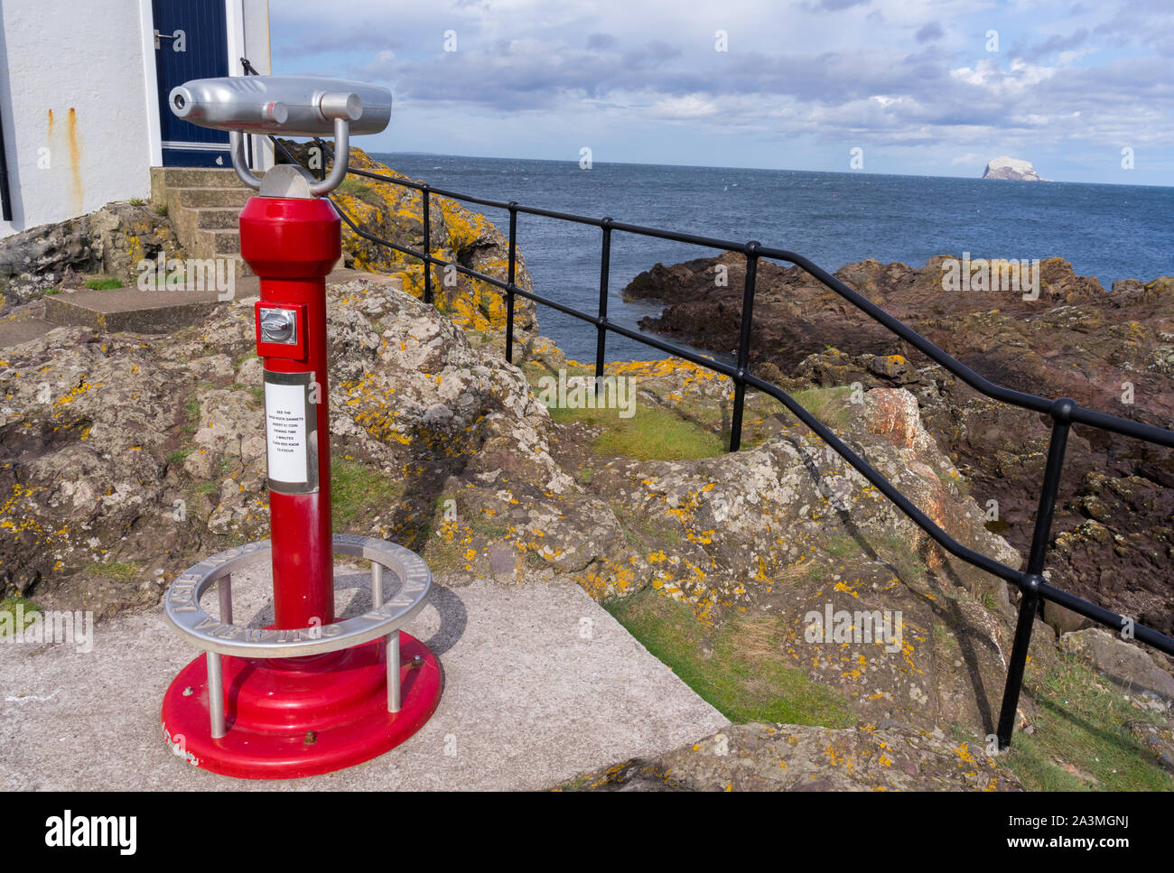 A coin operated telescope at North Berwick on the East Lothian Coast looking out towards The Bass Rock in the Firth of Forth Stock Photo