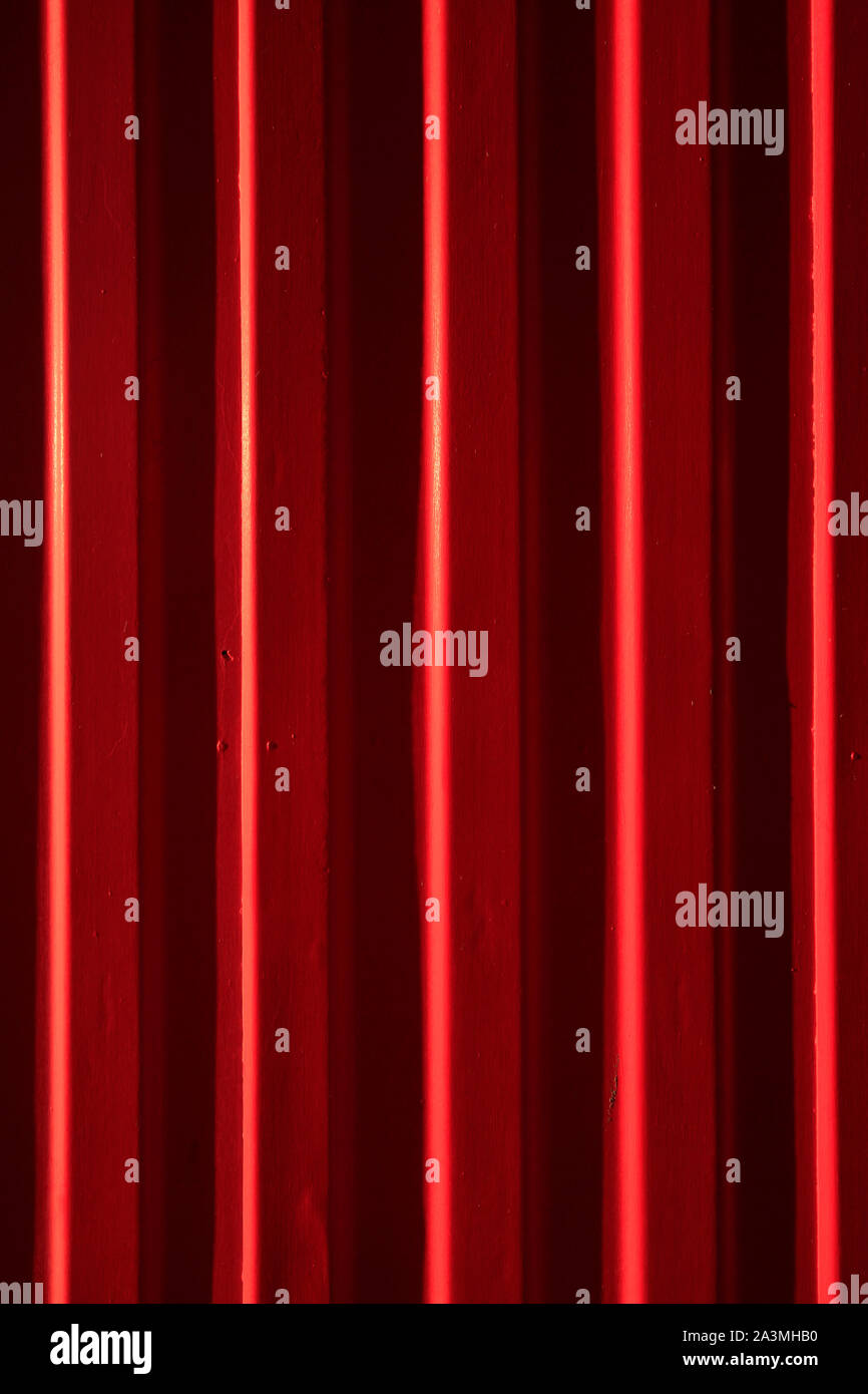 Bright red painted brick wall Stock Photo - Alamy