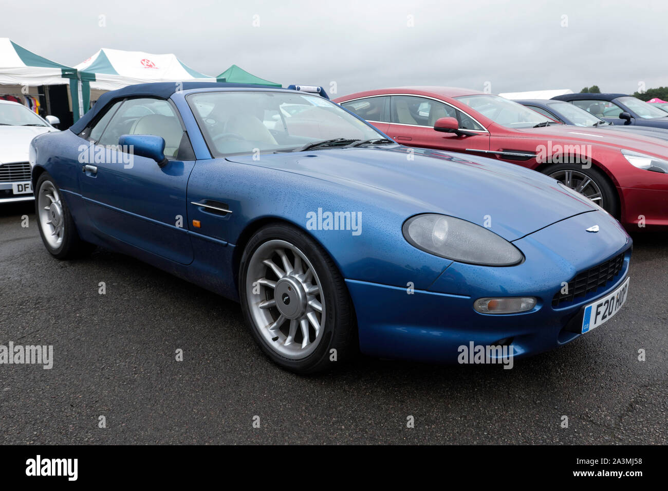Three-quarters front view of a Blue 1997, Aston Martin DB7, on display at the 2019 Silverstone Classic Stock Photo