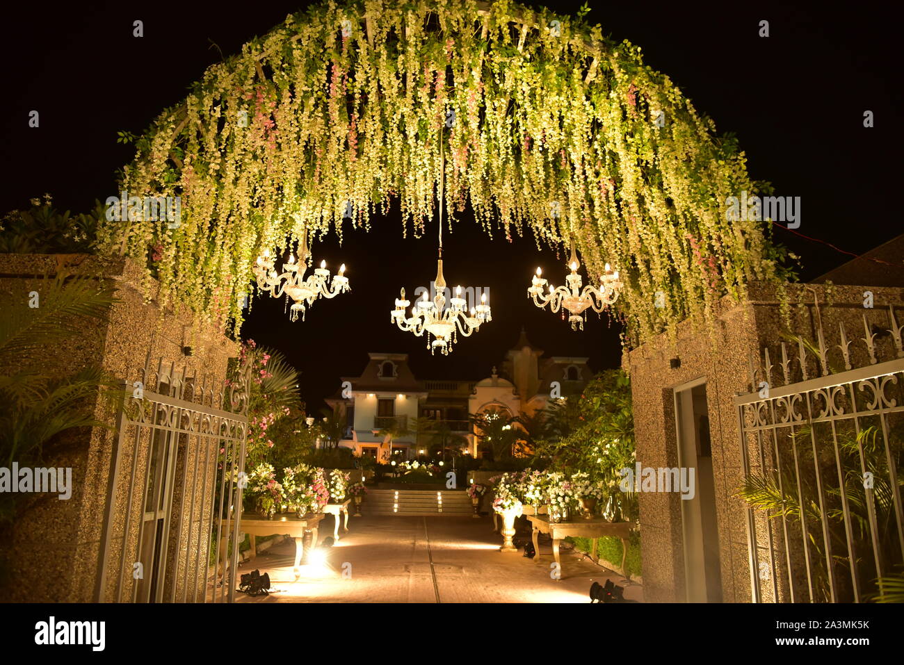 decorative gate with lights and flowers Stock Photo