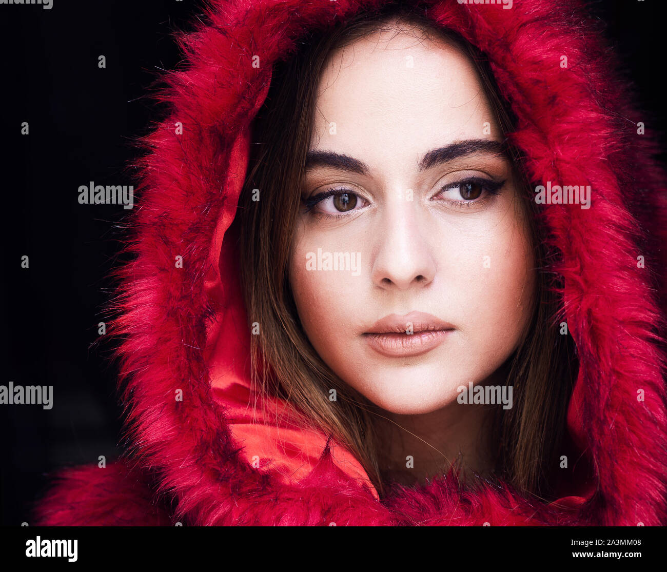 beautiful young Georgian woman wearing hooded fake fur coat Stock Photo