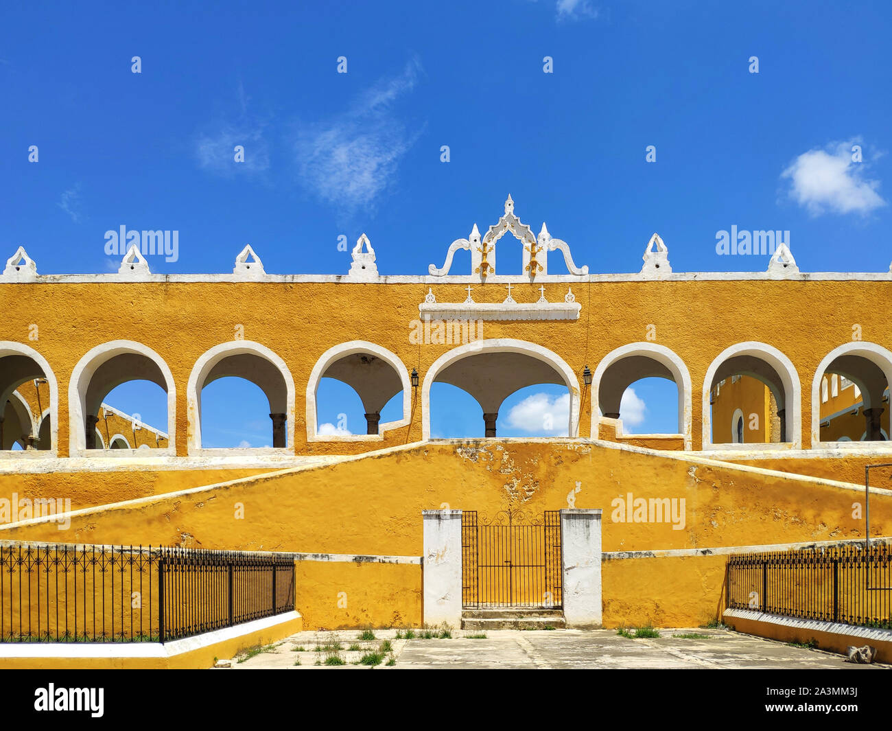 Yellow facade with arcades in a convent of Izamal, Mexico Stock Photo