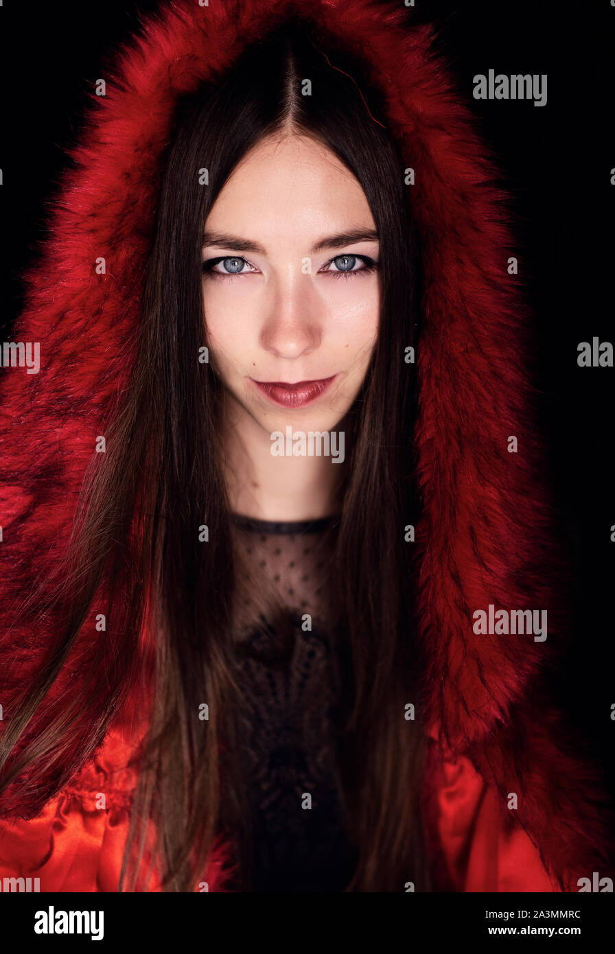 beautiful young Russian woman with blue eyes and brown hair wearing red